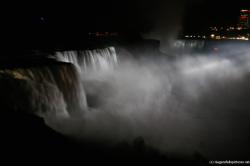 Horseshoe Niagara Falls at night lit by white light show.jpg