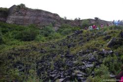 Jagged black rocks next to American Niagara Falls.jpg