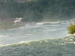 Maid of Mist at a distance as seen from American side of the Niagara Falls.jpg