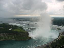 Maid of the Mist leaving Horse shoe Falls picture as viewed from Skylon Tower in Niagara Falls Canada.jpg