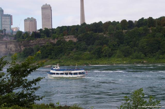 Maid of the Mist passing by bottom of Niagara Falls Observation Tower.jpg