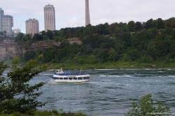 Maid of the Mist passing by bottom of Niagara Falls Observation Tower.jpg