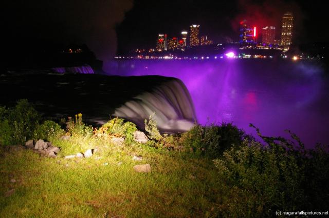 Niagara Falls at night during light show as seen from Terrapin Point.jpg