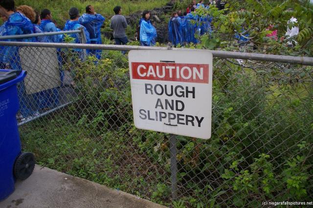 Niagara Falls caution sign at the base of Prospect Point.jpg