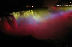 Niagara Falls Horseshoe falls at night light show with many colors.jpg