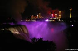 Purple light bath the Niagara Falls at night in light show.jpg