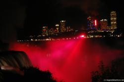 Red Light covers the Niagara Falls as night in light show.jpg