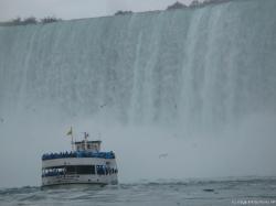 Close up of a Maid of the Mist tour boat nearing Horseshoe Falls.jpg