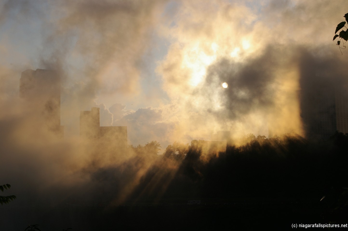 The sun peers through the mist of the Niagara Falls.jpg