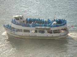 Tourists in blue raincoats on the Maid of the Mist ship in Niagara Falls.jpg