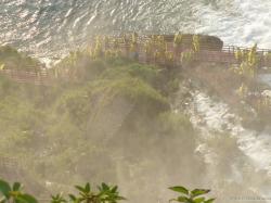 Tourists in yellow rain coats on the red staircases of the Bridal Veil Falls in Niagara Falls.jpg